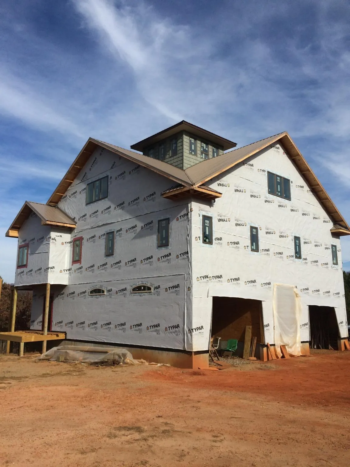 New two story house under construction with a cupola and gabled roofs in Reedsville